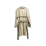 ST JOHN cream trench coat back view with dark patterned trim and tie belt