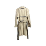 ST JOHN cream trench coat back view with dark patterned trim and tie belt