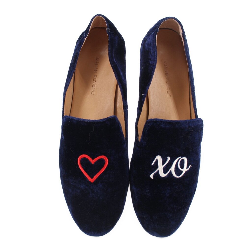 Navy slipper flats, red heart on one shoe and 'xo' on the other