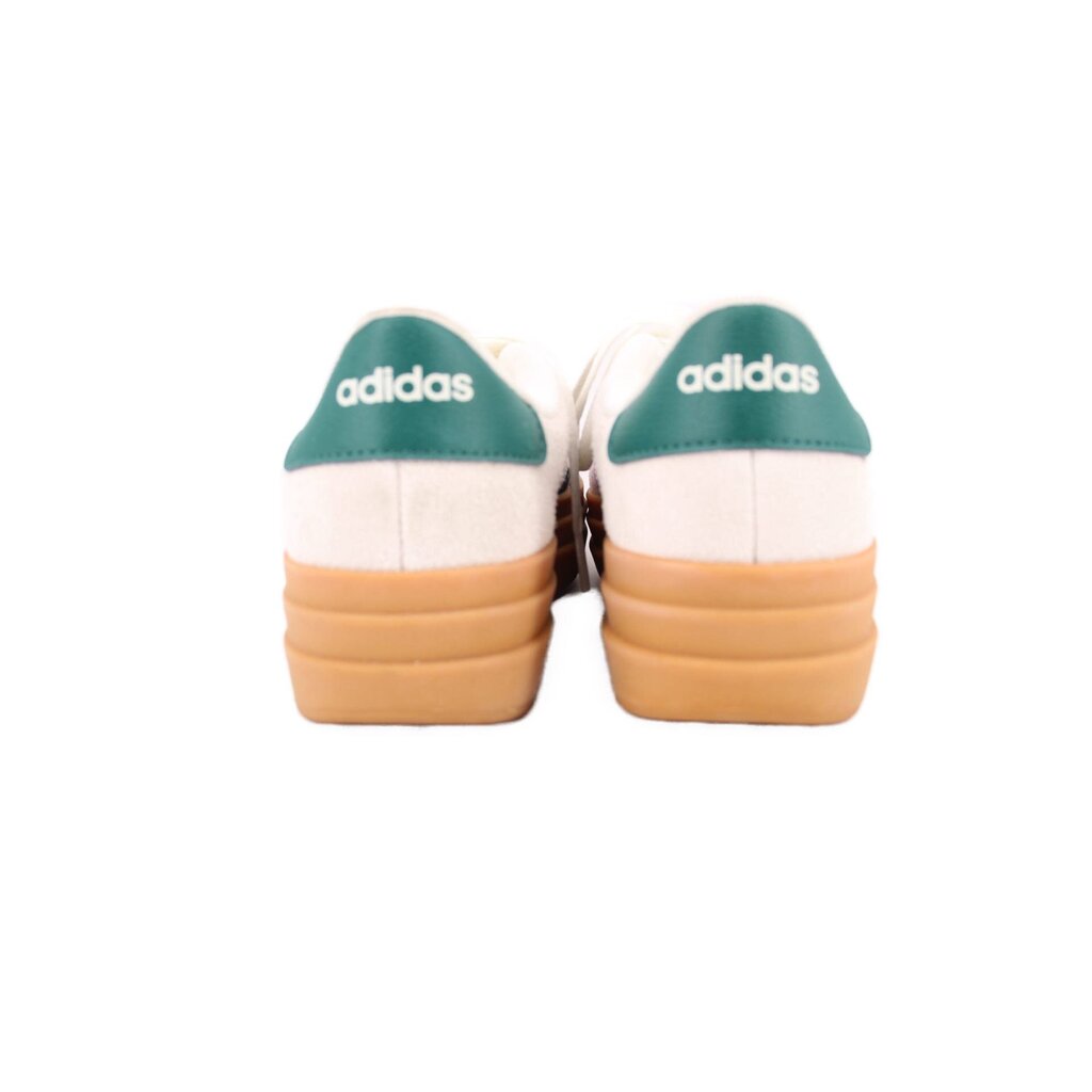 Cream Adidas sneakers with green heel tabs and tan gum rubber outsole