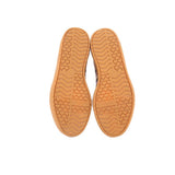 Tan gum rubber sneaker outsole with textured tread and adidas logo