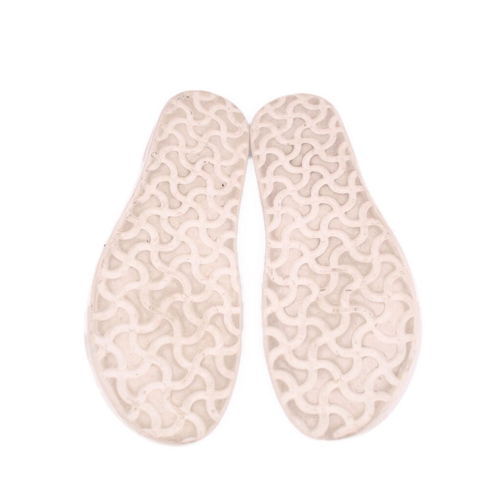BIRKENSTOCK leather sneakers outsole view, textured tread on white rubber