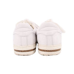 BIRKENSTOCK leather sneakers in white, heel view with tan-speckled sole
