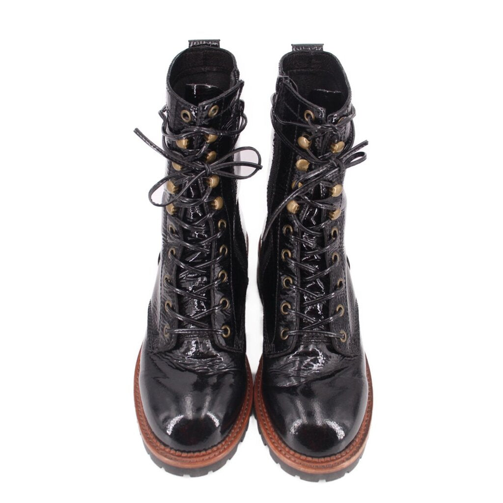 Pair of black glossy lace-up ankle boots with gold eyelets and brown rubber soles