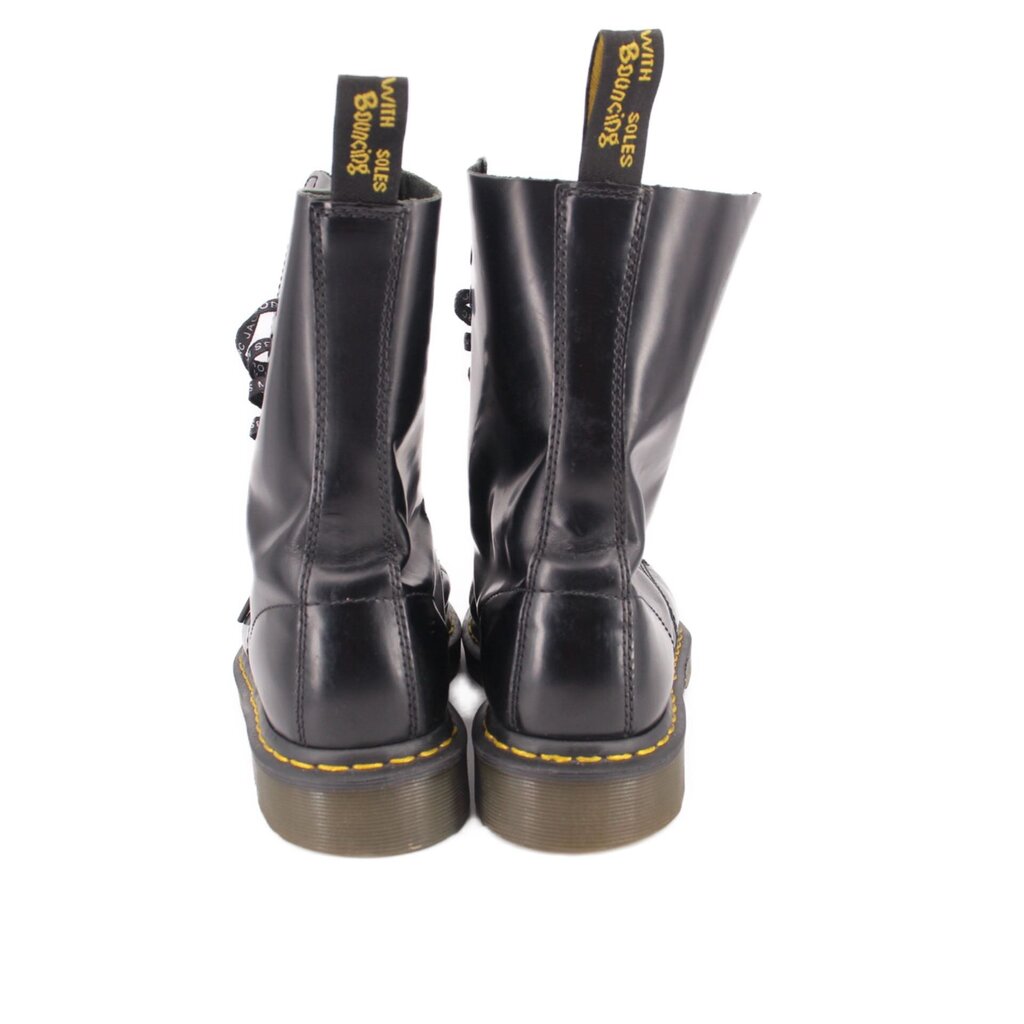 Black leather boots with back pull tabs and yellow welt stitching