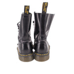 Black leather boots with back pull tabs and yellow welt stitching