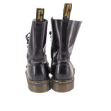 Black leather boots with back pull tabs and yellow welt stitching