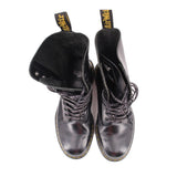 Black lace-up boots with plush lining and yellow logo text on tongue