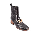 Black glossy ankle boots with chunky block heel and gold-tone chain detail