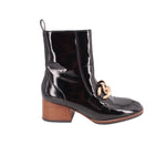 Black patent ankle boots with chunky heel and gold-tone chain strap detail