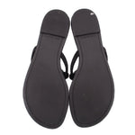 Pair of black knotted thong sandals with textured sole and open toe