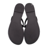 Pair of black knotted thong sandals with textured sole and open toe