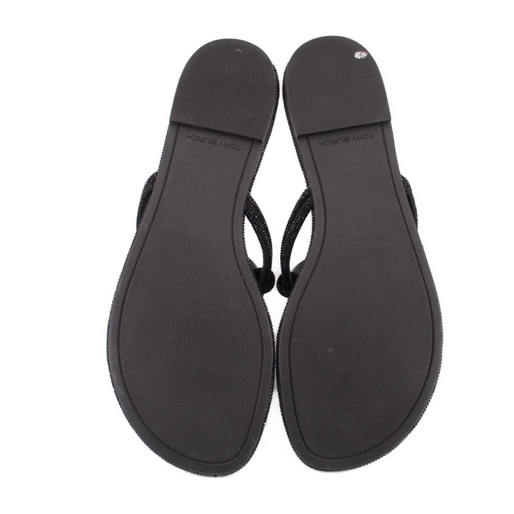 Black thong sandals with smooth back soles and attached straps