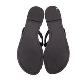 Black thong sandals with smooth back soles and attached straps