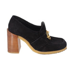 Black suede loafers with gold buckle strap and tall wooden block heel