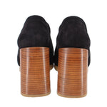 Black suede loafers with stacked heel and stitched rear panel