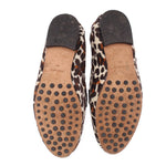 Leopard-print felt loafer bottoms with dotted rubber tread and brown interior