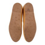 Yellow leather flat insides with patterned logo print on footbed