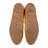 Yellow leather flat insides with patterned logo print on footbed