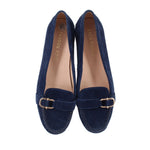 Pair of blue suede loafers with gold-toned buckle across the vamp