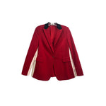 Red one-button blazer with dark lapels, notch collar, and cream contrast sleeve panels