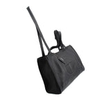Telfar medium carry shoulder bag in black pebbled leather, embossed logo and long strap