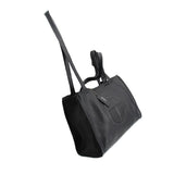 Telfar medium carry shoulder bag in black pebbled leather, embossed logo and long strap