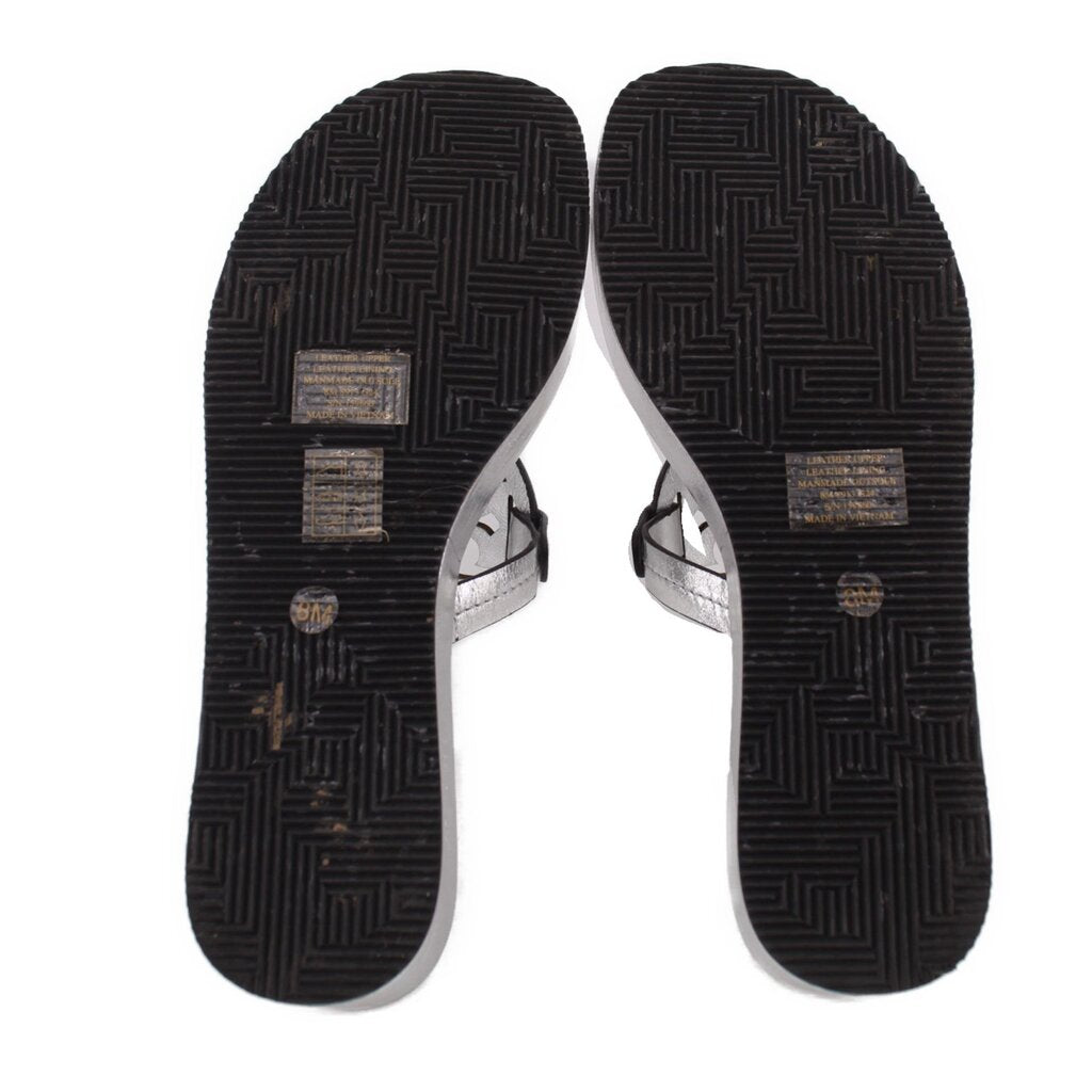 Black patterned outsoles for silver platform wedge sandals, toe and heel pads.