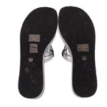 Black patterned outsoles for silver platform wedge sandals, toe and heel pads.