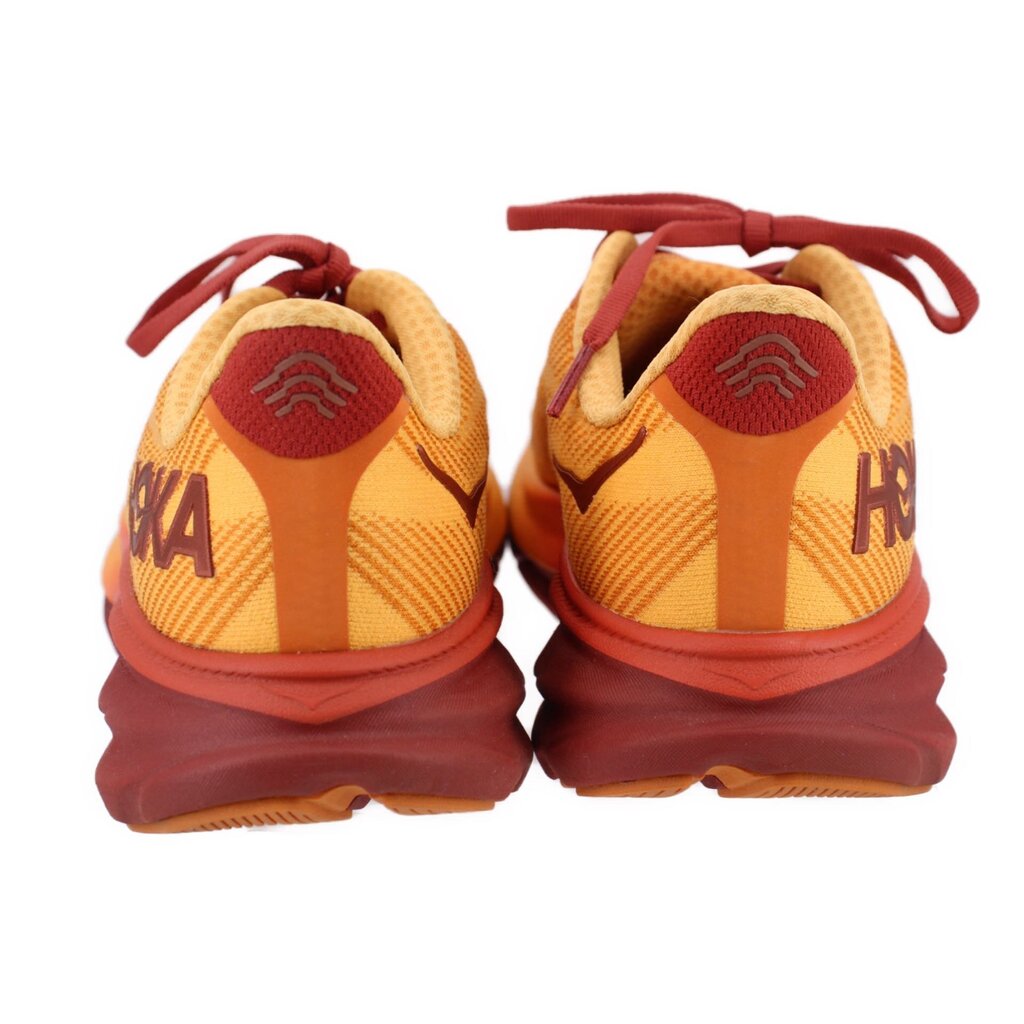 Orange mesh running sneakers pair with maroon heel and HOKA logo