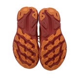 Orange rubber outsole tread shown on mesh running sneakers
