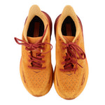 Orange mesh running sneakers pair with maroon laces, heel interior visible