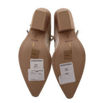 Cream ankle boot outsole and heel, showing molded sole and stacked heel