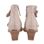Cream studded ankle boot with side zipper and stacked wedge heel, rear view