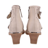 Cream studded ankle boot with side zipper and stacked wedge heel, rear view