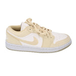 Women's low-top sneakers, tan and white, side view with Swoosh and lace-up