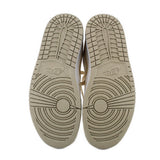 Tan sneaker outsoles with deep tread pattern
