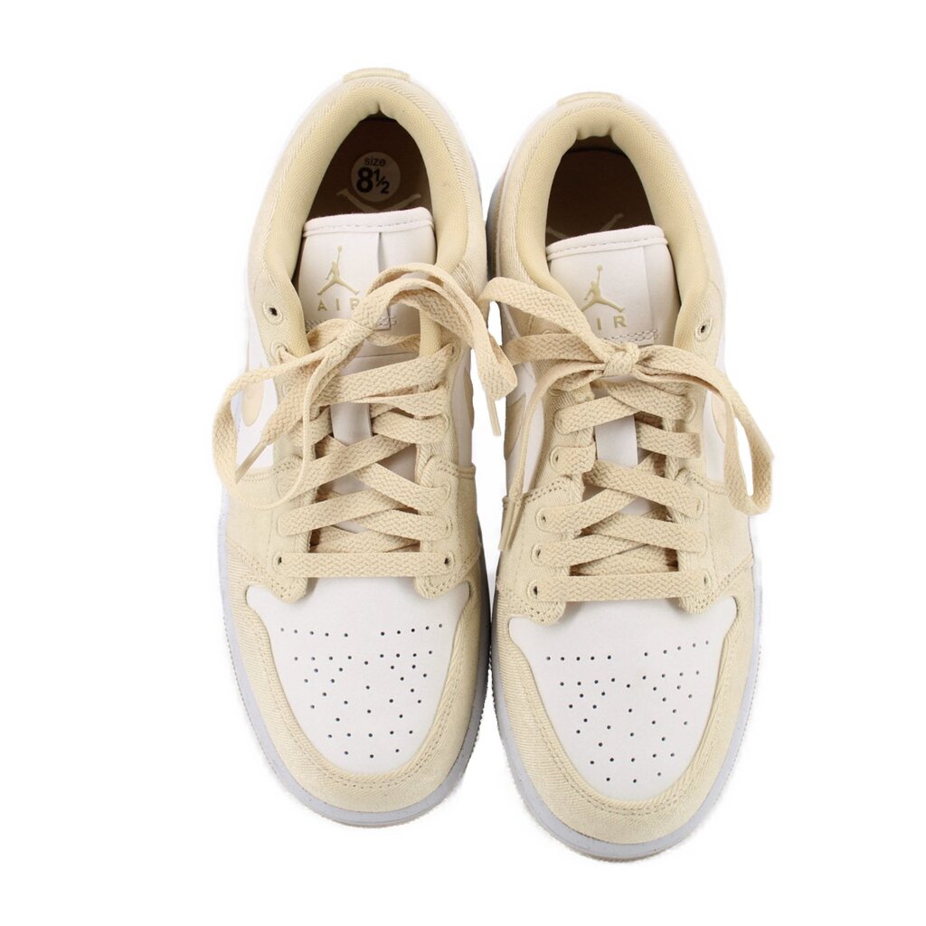Women's low-top sneakers in tan and white, front view showing tongue and insoles