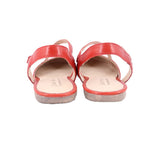 Red leather flats with wide toe straps and low cushioned sole