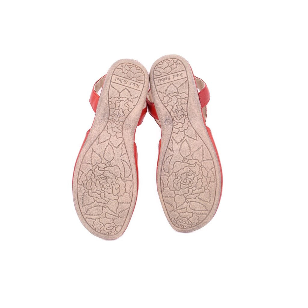 Red leather flats, view of treaded outsole with patterned grip