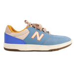 Blue New Balance tennis sneakers with white side panel, orange N, and beige laces