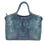 Blue embossed leather satchel with top handles, emblem patch, and snap closure