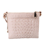 Cream embossed leather crossbody bag with zip closure and top carry loop detail.