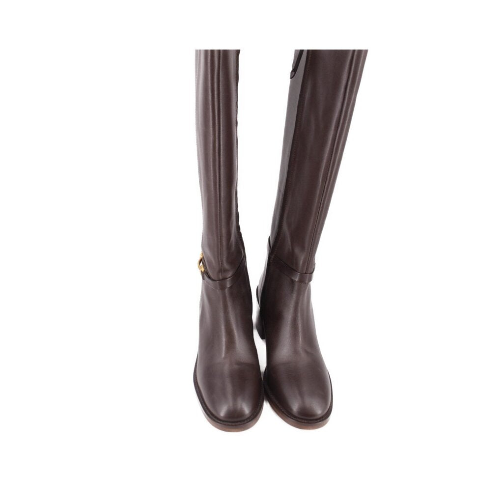 Pair of brown leather tall boots showing front toes and tall shaft