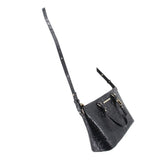 Black croc-embossed mini satchel on a long crossbody strap with gold hardware