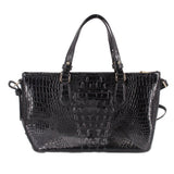 Black croc-embossed mini satchel with structured top, dual handles, gold accents