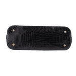 Black croc-embossed satchel base with snap studs along the top edge