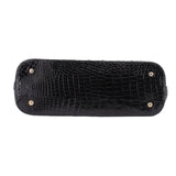 Black croc-embossed satchel base with snap studs along the top edge