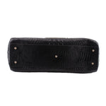 BRAHMIN black croc-embossed tote side view with reinforced base and metal studs