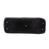 BRAHMIN black croc-embossed tote side view with reinforced base and metal studs